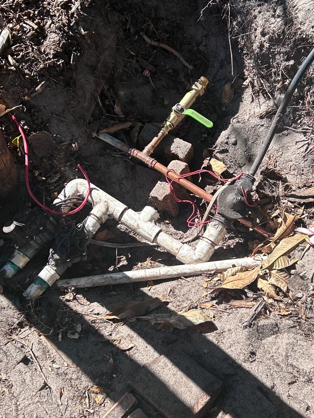 Old reticulation manifold dug up and exposed before replacement.