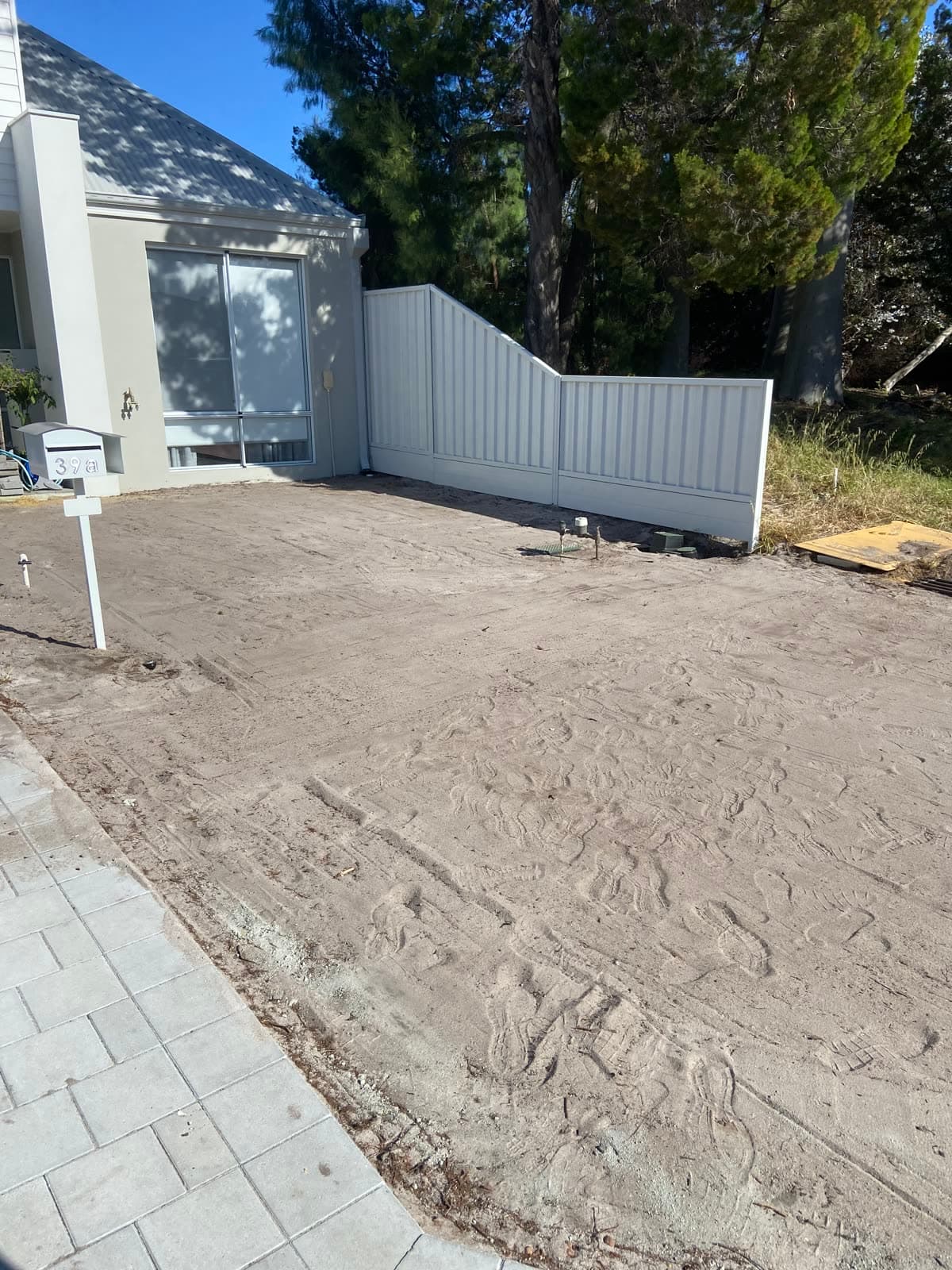 Freshly installed garden bed and lawn.